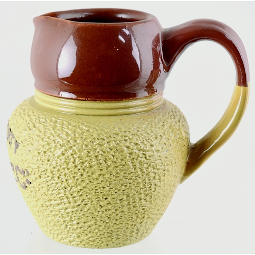 596 - SMALL RAILWAY (?) MILK JUG. 2.75ins tall, t.t., handled jug with textured lower half & brown transfe... 