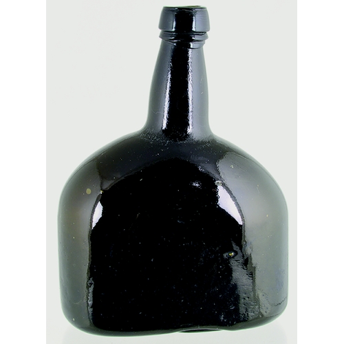 721 - FLATTENED BLACK GLASS WINE BOTTLE. 8.25ins tall. Very dark brown/ black glass, flat 'paddled' sides,... 