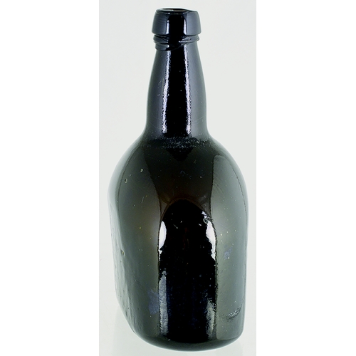 721 - FLATTENED BLACK GLASS WINE BOTTLE. 8.25ins tall. Very dark brown/ black glass, flat 'paddled' sides,... 