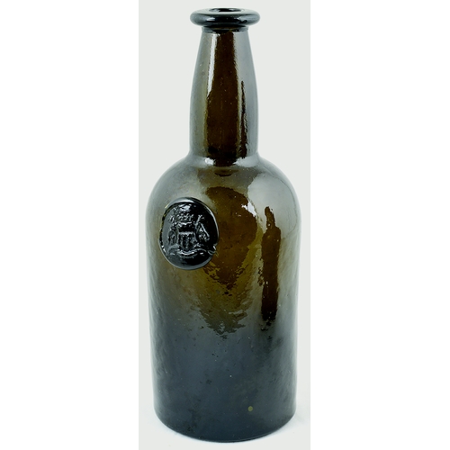 723 - SEALED WINE BOTTLE. 9.75ins tall. Dark brown glass, applied lip, kick up base pontil. Crude front se... 