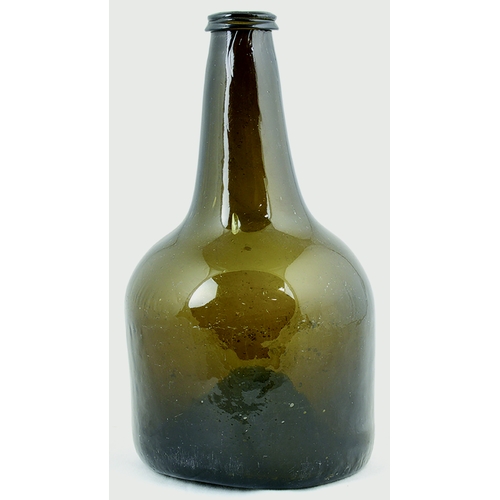 724 - MALLET FORM WINE BOTTLE. 9.25ins tall. Brown glass, tapered neck, rolled lip, kick up base pontil. I... 