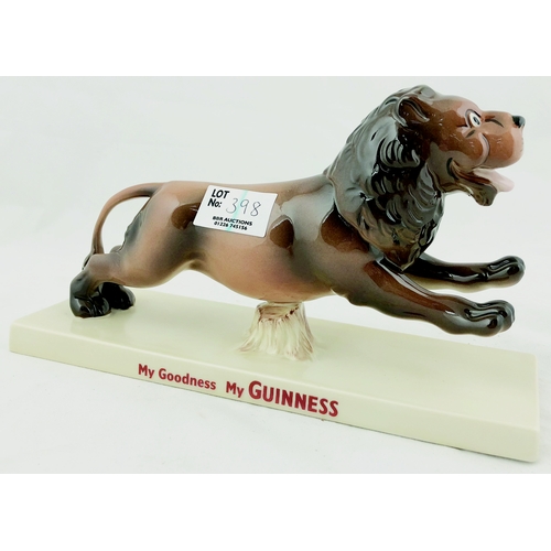 398 - GUINNESS STRIDING LION. 8.6ins long, hand coloured running lion atop rectangular base - front, & bac... 