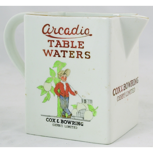 47 - ARCADIA FRUIT CRUSHES WATER JUG. 4.5ins tall. White glaze with multicoloured images either side of y... 