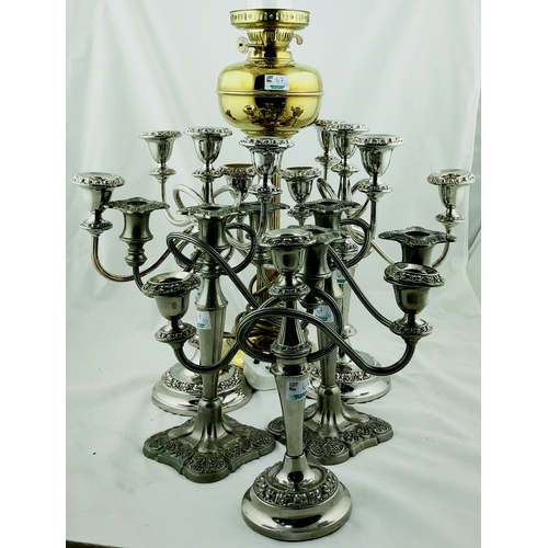 67 - OIL LAMP & CANDLEABRA GRP. 27ins, brass & glass oil lamp with ribbed stem plus 5 silver in colour ca... 