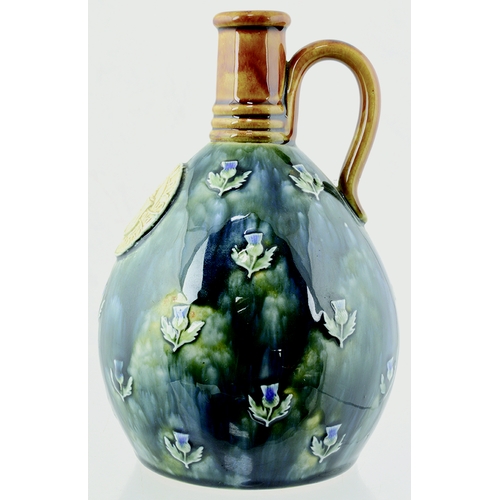 2 - Mackinlays Doulton Artware Whisky Jug. 8ins tall, tan top & handle. Mottled blue & green body artwar... 