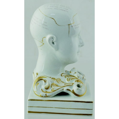 10 - PHRENOLOGIST HEAD INKWELL. 5.5ins tall, off white glaze with gold highlights. Various pats of the br... 