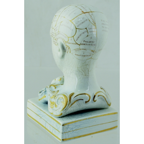 10 - PHRENOLOGIST HEAD INKWELL. 5.5ins tall, off white glaze with gold highlights. Various pats of the br... 