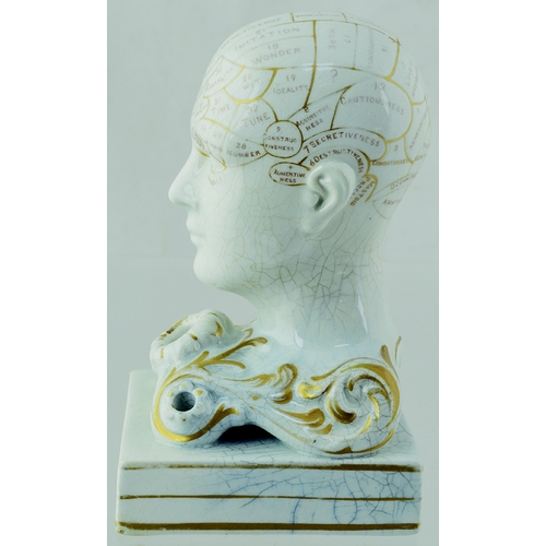 10 - PHRENOLOGIST HEAD INKWELL. 5.5ins tall, off white glaze with gold highlights. Various pats of the br... 