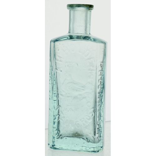 11 - Holdens Tommy Bottle. 4.3ins, ice blue glass, rectangular body, heavy, chamfered corners, delicate l... 