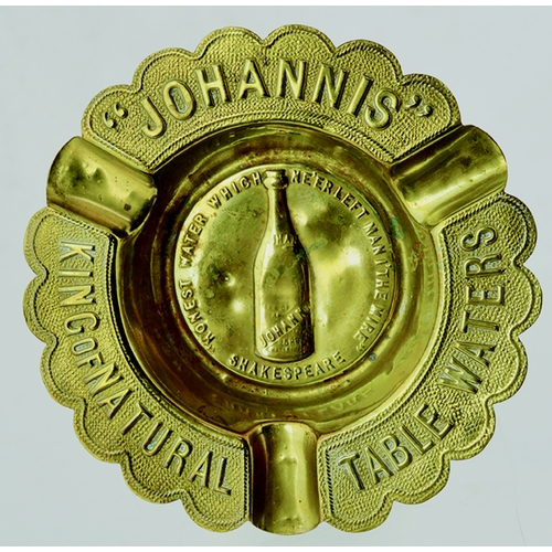 16 - Johannis Table Waters Ashtray. 4.6ins diam, brass, fancy curved edges,. Raised embossing “ JOHANNIS”... 