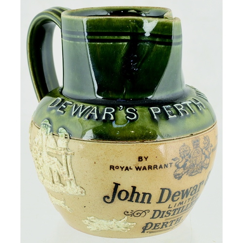 49 - DEWARS PERTH WHISKY JUG. 4ins tall, green top, lower tan, rear handle, white raised lettering round ... 