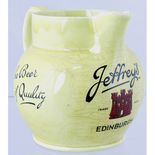 54 - JEFFREY’S EDINBURGH PUB JUG. 4.2ins tall, cream glaze, rear handle, black transfer with red castle t... 