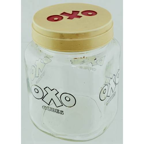 66 - VINTAGE OXO CUBES GLASS JAR. 7ins tall, clear glass, white lettering with black outer, cream lid wit... 