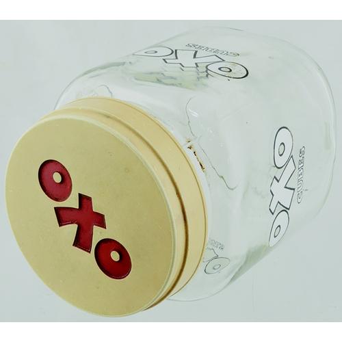 66 - VINTAGE OXO CUBES GLASS JAR. 7ins tall, clear glass, white lettering with black outer, cream lid wit... 