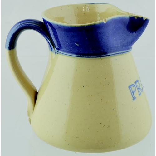 30 - NORTHANMPTONSHIRE BEER JUG. 4ins tall, mid blue top, off white glaze, rear handle, PRAED’S blue tran... 