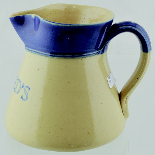 30 - NORTHANMPTONSHIRE BEER JUG. 4ins tall, mid blue top, off white glaze, rear handle, PRAED’S blue tran... 