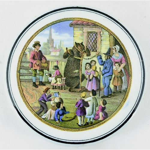 5 - THE VILLAGE WAKES POT LID. (KM 321) 3.75ins diam. Multicoloured image, produced by the Pratt factory... 