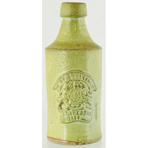 40 - DATED BLACKBURN SLAB SEAL GINGER BEER. 7ins tall. Grey/ green slip glaze, front slab seal JAMES HODS... 