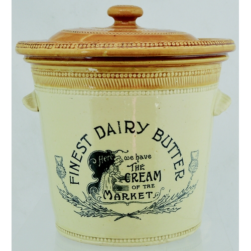 64A - FINEST DAIRY BUTTER BUTTERCROCK. 10.5ins tall to top of lid. Tan top & lid, wheeled decoration, cris... 