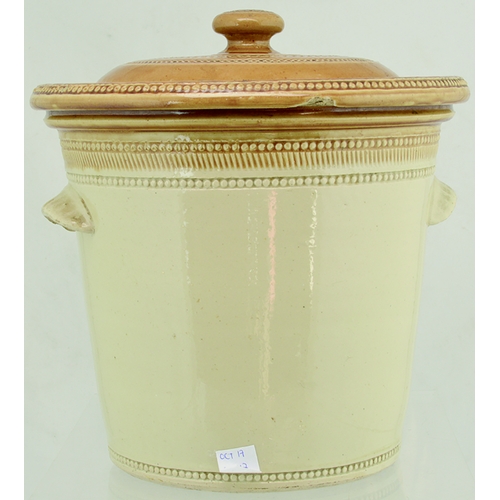 64A - FINEST DAIRY BUTTER BUTTERCROCK. 10.5ins tall to top of lid. Tan top & lid, wheeled decoration, cris... 