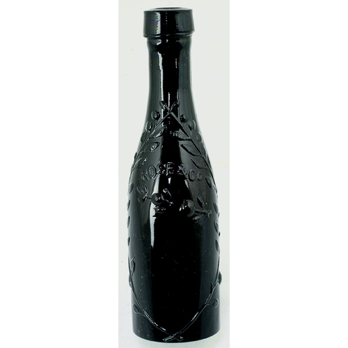 70 - ROSES LIME CORDIAL BOTTLE. 4.75ins tall. Very dark purple almost black glass bottle embossed with fo... 