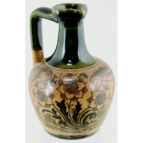 71 - JAS SHOOLBRED WHISKY JUG. 3.75ins tall. Green top & handle, lower tan salt glaze, all over dark brow... 