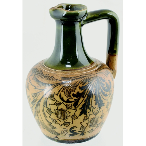 71 - JAS SHOOLBRED WHISKY JUG. 3.75ins tall. Green top & handle, lower tan salt glaze, all over dark brow... 