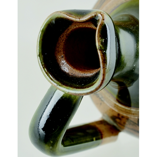 71 - JAS SHOOLBRED WHISKY JUG. 3.75ins tall. Green top & handle, lower tan salt glaze, all over dark brow... 