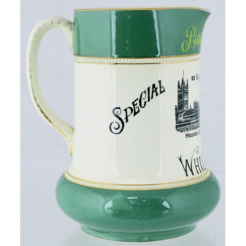 73 - BUCHANANS WHISKY WATER JUG. 6.25ins tall. Late 19th century, Buchanans green top & lower section, wi... 