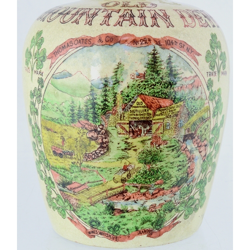 77 - MOUNTAIN DEW WHISKY JUG. 7.75ins tall. Tan neck & rear handle, main body cream glaze, multicoloured ... 