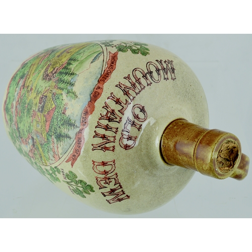 77 - MOUNTAIN DEW WHISKY JUG. 7.75ins tall. Tan neck & rear handle, main body cream glaze, multicoloured ... 