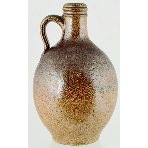 81 - BURY ST EDMUNDS BELLARMINE STYLE FLAGON. 8.75ins tall. Variating brown salt glaze, rear handle. Roya... 