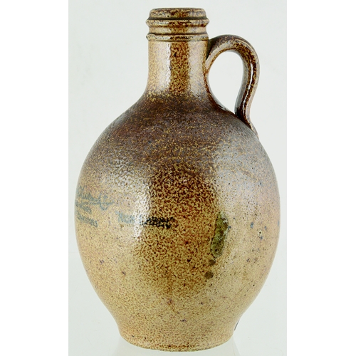 81 - BURY ST EDMUNDS BELLARMINE STYLE FLAGON. 8.75ins tall. Variating brown salt glaze, rear handle. Roya... 