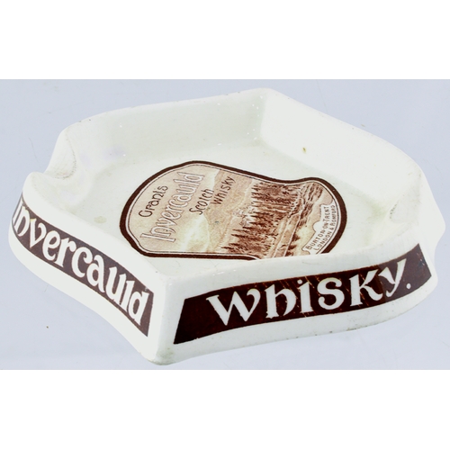 84 - GRANTS SCOTCH WHISKY ASHTRAY. 4.75ins across. White glaze, with brown detailing INVERCAULD WHISKY ar... 