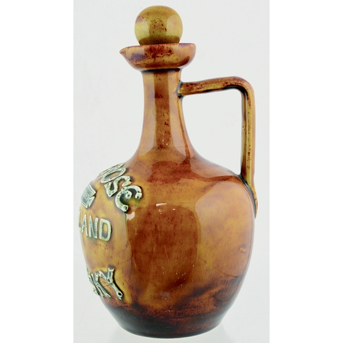 85 - MELROSE ARTWARE WHISKY JUG. (WG pg 29) 8.5ins tall to top of (original) stopper. Mottled tan glaze, ... 