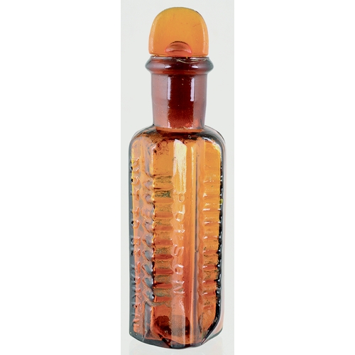 99 - ETON STAR POISON BOTTLE. (DP pg 58) 4.25ins tall to top of original ground glass stopper. Amber glas... 