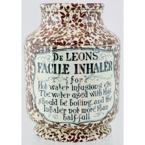 111 - DE LEONS FACILE INHALER. 4.75ins tall. Cream glaze with brown all over body floral decoration, front... 