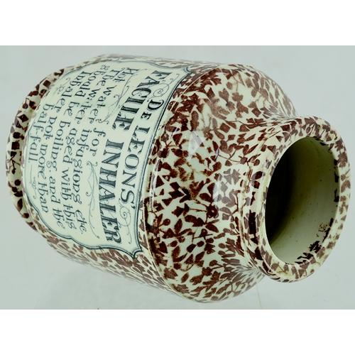 111 - DE LEONS FACILE INHALER. 4.75ins tall. Cream glaze with brown all over body floral decoration, front... 