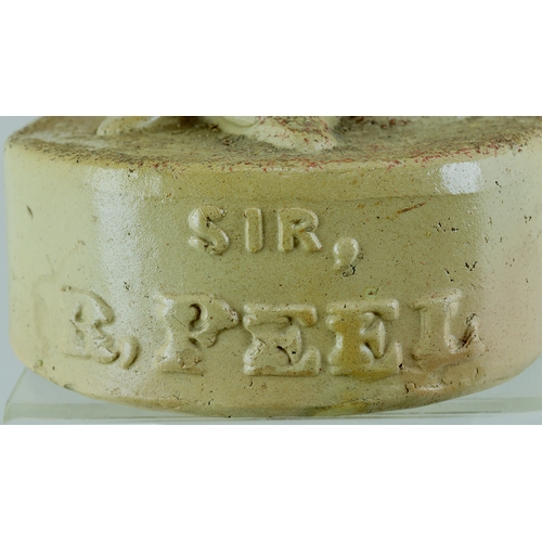 116 - SIR ROBERT PEEL REFORM FLASK. 12ins tall. Light tan salt glaze flask formed as Sir Robert Peel stood... 