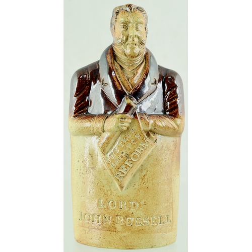 120 - LORD JOHN RUSSELL REFORM FLASK. 7.25ins tall. Shiny variating tan salt glaze flask in shape of Lord ... 