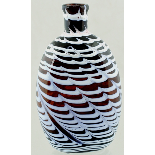 136 - NAILSEA TYPE HIP FLASK. 4.6ins tall, black glass flattened curvilinear body (dark brown) with tightl... 