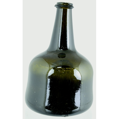 140 - SEALED MALLET WINE BOTTLE. 7.75ins tall. Dark olive brown glass, c.1730-40 mallet shape, vee shaped ... 