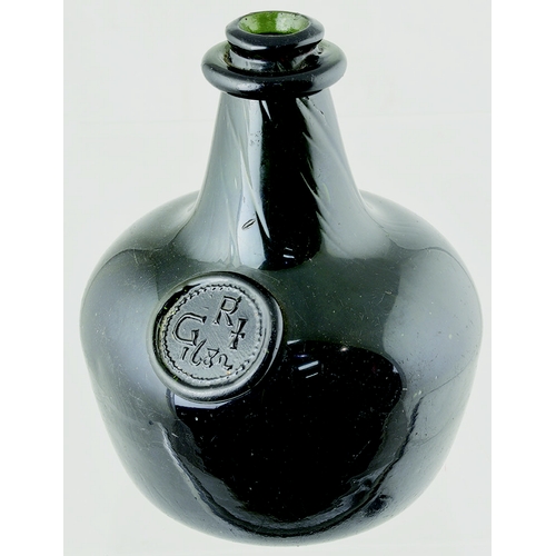 144 - A LATE STYLE ENGLISH SHAFT AND GLOBE WINE BOTTLE.
- a late style English shaft and globe wine bottle... 