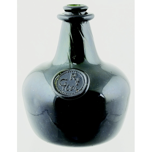 144 - A LATE STYLE ENGLISH SHAFT AND GLOBE WINE BOTTLE.
- a late style English shaft and globe wine bottle... 