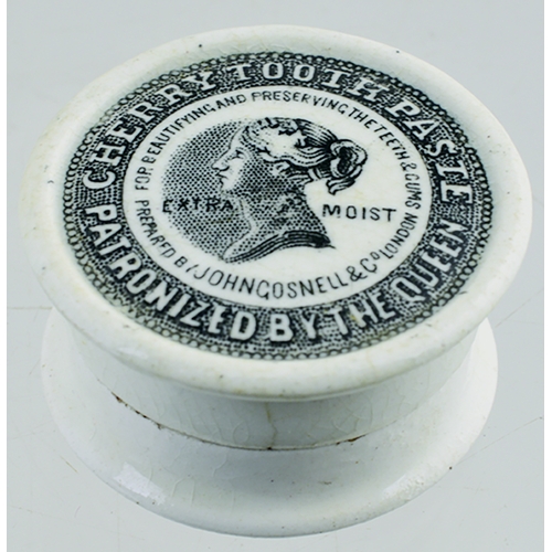 520 - MINIATURE CHERRY TOOTH PASTE POT LID & BASE. (APL p 304, 63a) 1.25ins diam. White glaze, central bla... 