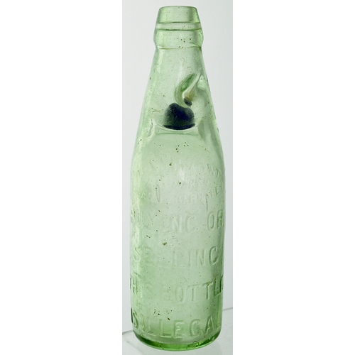 563 - BERMONDSEY BLUE MARBLE CODD BOTTLE. 9.25ins tall. Aqua glass, 2 neck retaining lugs, embossed front ... 