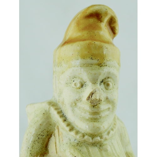 584 - MR PUNCH FIGURAL INKWELL. 5 ins tall. Off white glaze with light tan hat. Shaped as a seated Mr Punc... 