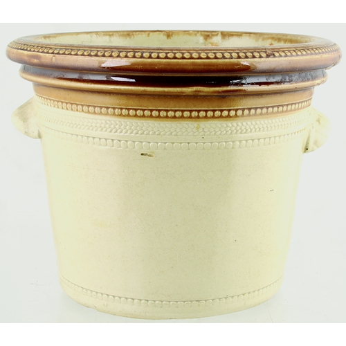 611 - EDINBURGH DANISH DAIRY BUTTERCROCK. 6ins tall. Tan top, lower off white glaze, wheeled decoration ar... 