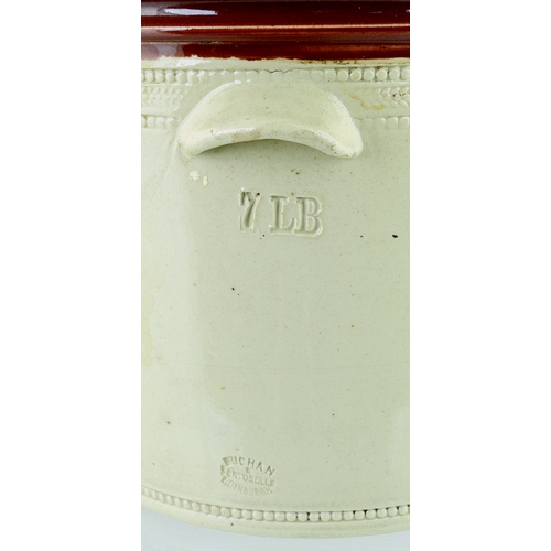 614 - BUTTERCUP DAIRY BUTTERCROCK. 8ins tall to top of lid. Tan top & lid, lower off white glaze, wheeled ... 