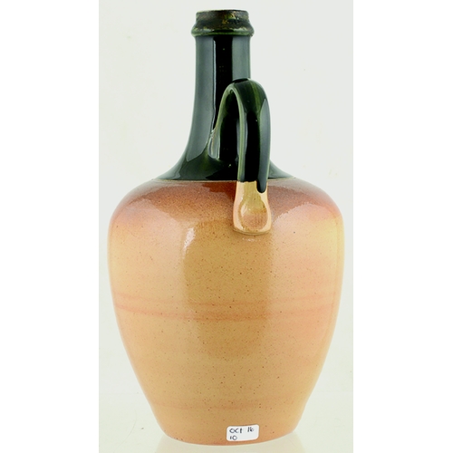 632 - DEWARS PERTH WHISKY JUG. (WG p 55) 9.5ins tall. Dark green neck & handle, lower tan salt glaze, clas... 